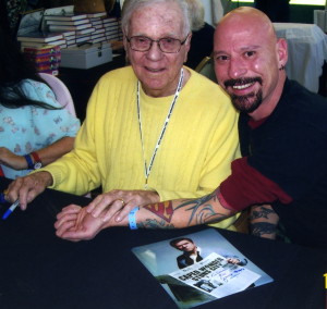 The late, great, Jackie Cooper appreciated my show of fandom through my tattoos. This can be seen in the photo as he placed a hand on my arm.