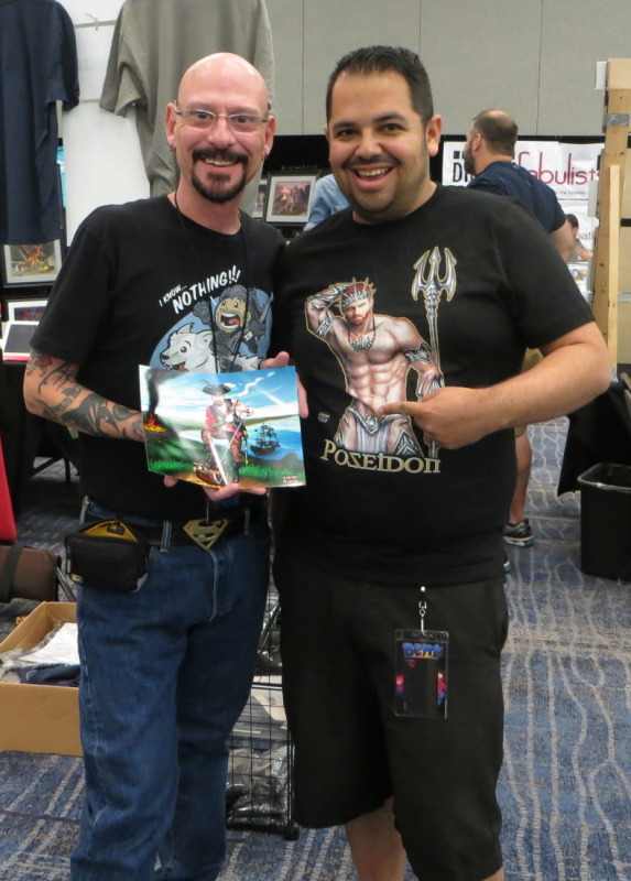 With artist Steven H Garcia and a copy of the commission I had him do.